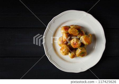 Fresh Cooked, new potatoes,with dill, on a wooden table, selective focus. close-up, toning, no people, 117425626