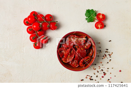dried tomatoes, in a bowl, top view, on a white background, dried tomatoes, in a bowl, top view, on a white background, 117425641