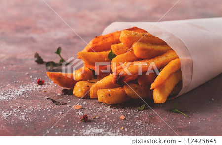 Fried French fries, in a paper bag, on an abstract background, no people, rustic, Fried French fries, in a paper bag, on an abstract background, no people, rustic, 117425645