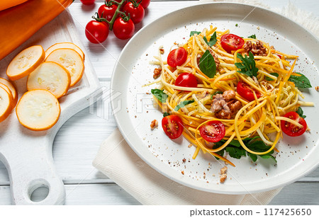 yellow zucchini salad, with cherry, vegetarian food, sliced into strips, homemade, 117425650