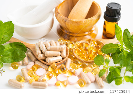 Alternative medicine herbal organic capsule, mineral, drug with herbs leaf natural supplements for healthy good life. Alternative medicine herbal organic capsule, mineral, drug with herbs leaf natural supplements for healthy good life. 117425924