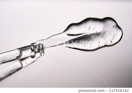Pipette with cosmetic gel or serum close-up. 117426182