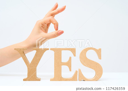 Wooden alphabet blocks arranged to spell out "YES" Wooden alphabet blocks arranged to spell out "YES" 117426359