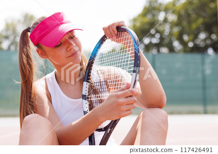 young woman playing tennis on the tennis court, olympic sport young woman playing tennis on the tennis court, olympic sport 117426491