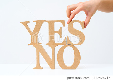 Wooden alphabet blocks arranged with the letters "YES" and "NO" Wooden alphabet blocks arranged with the letters "YES" and "NO" 117426716