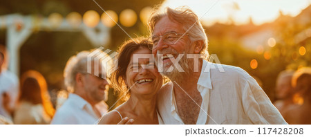 Happy senior couple dancing. Middleaged peope dancing at an outdoor party. Outdoor wedding party 117428208