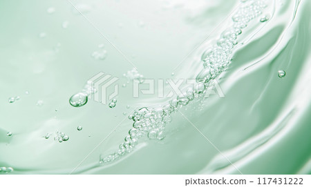 A beautiful and realistic AI-generated image of light green liquid and tiny bubbles reminiscent of a cosmetic product. 117431222