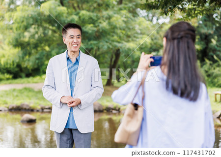 Senior couple taking pictures with smartphone Senior couple taking pictures with smartphone 117431702