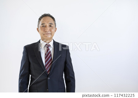 A businessman in his 60s looking at the camera A businessman in his 60s looking at the camera 117432225
