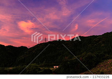 Summer 2024 Evening view of Nunome Dam in eastern Nara City. Burnt sky on the north (valley) side of the dam. Beautiful gradation sky on the northeast side.② 117433226