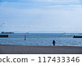 A young man staring at the sea 117433346
