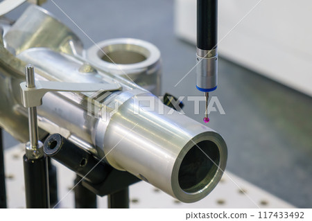 The  CMM probe measuring the  aluminum automotive parts. 117433492