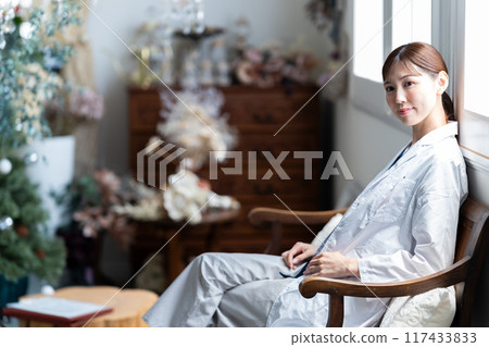 Female doctor taking a break Female doctor taking a break 117433833