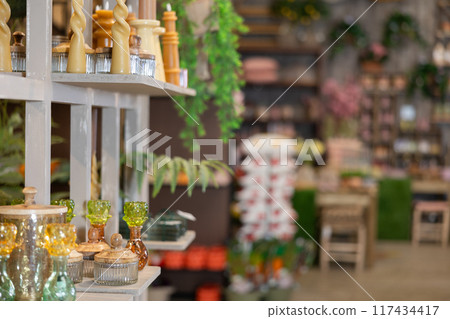 Various candles, vases, flower pots and other decorative decorations and gifts in hardware store 117434417