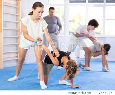 Boy and girl practicing self-defense techniques Boy and girl practicing self-defense techniques 117434946