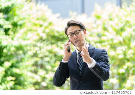Businessman, smartphone, call trouble Businessman, smartphone, call trouble 117435702