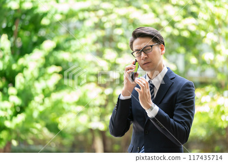Businessman, smartphone, call trouble Businessman, smartphone, call trouble 117435714
