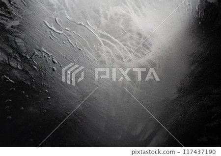 abstract black wet surface closeup background 117437190