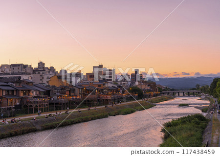 A seasonal sight in summer in Kyoto: Kamogawa River cool deck, evening view 117438459