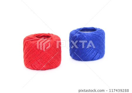 A picture of thread spools isolated on white background A picture of thread spools isolated on white background 117439288