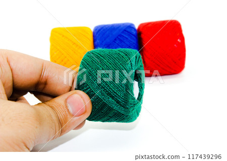 A picture of thread spools isolated on white background 117439296