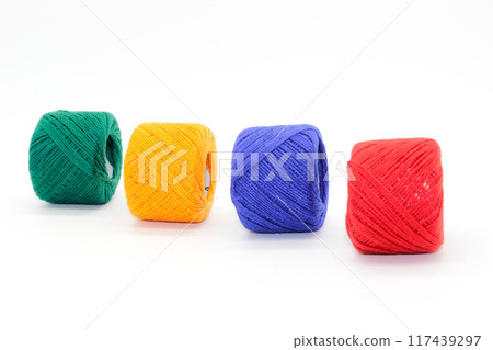 A picture of thread spools isolated on white background A picture of thread spools isolated on white background 117439297