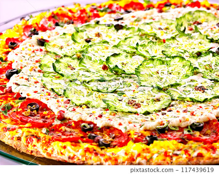 Gluten free pizza with a cauliflower crust and assorted vegetable toppings served on a transparent 117439619