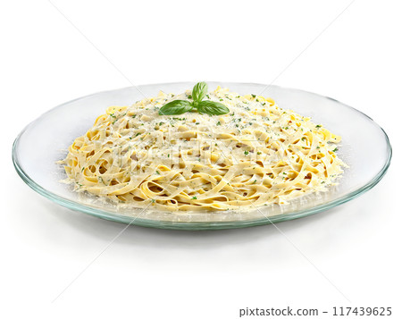 Fettuccine Alfredo with creamy sauce and Parmesan served on a transparent glass plate Italian American 117439625