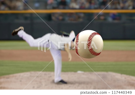 Baseball pitcher throwing fast ball to batter in a stadium Baseball pitcher throwing fast ball to batter in a stadium 117440349