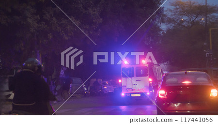 New Delhi, Delhi, India. Emergency Ambulance Reanimation Van Car On Moving With Siren On Press Enclave Marg, Saket District Centre street. Cars, Motorcycles, Buses, Auto Rickshaw Or Tuk-tuk Moving On 117441056