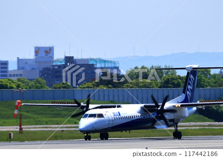 Osaka International Airport ANA Bombardier DHC8-Q400 propeller plane landing preparation Skypark Osaka International Airport ANA Bombardier DHC8-Q400 propeller plane landing preparation Skypark 117442186