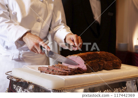 Chef cutting steak Chef cutting steak 117442369