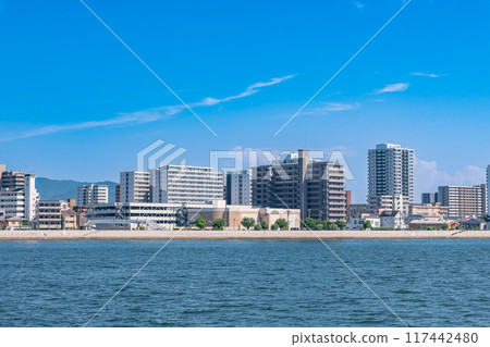 Riverside scenery in Hiroshima City: Ujina apartment complexes seen across the Motoyasu River Riverside scenery in Hiroshima City: Ujina apartment complexes seen across the Motoyasu River 117442480