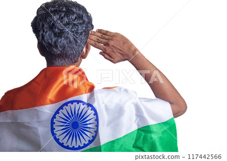 A young person saluting with an Indian flag draped over their shoulder in a white background. 117442566