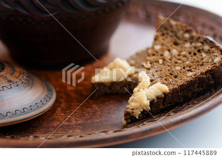 Red borscht in a pan with lard and green onions 117445889