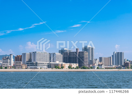 Riverside scenery in Hiroshima City: Apartment complex in Ujina district with blue sky 117446266