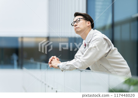 Depressed man in work clothes Depressed man in work clothes 117448020