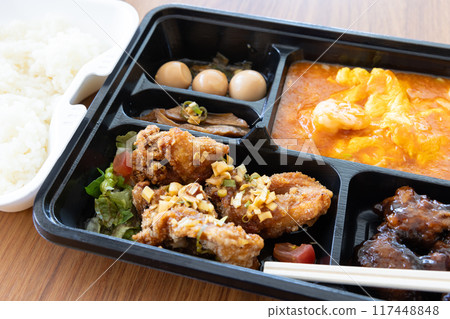 Delicious Chinese bento with chili shrimp and fried chicken 117448848