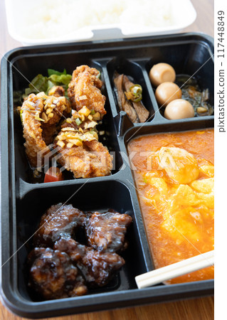 Delicious Chinese bento with chili shrimp and fried chicken 117448849