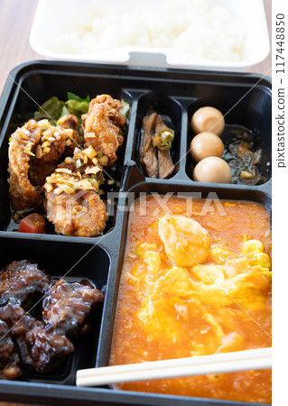 Delicious Chinese bento with chili shrimp and fried chicken Delicious Chinese bento with chili shrimp and fried chicken 117448850