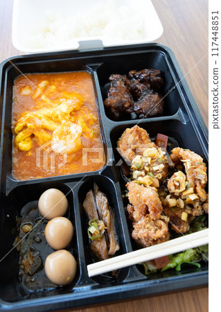 Delicious Chinese bento with chili shrimp and fried chicken 117448851