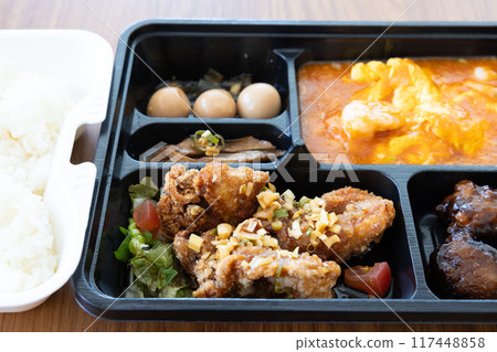 Delicious Chinese bento with chili shrimp and fried chicken 117448858
