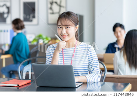 Young woman working in the office 117448946