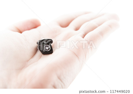 image of miniature phone hand white background 117449020