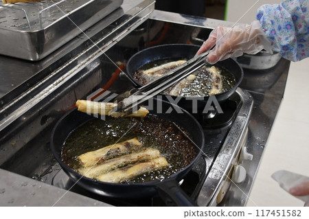 Filipino dish Turon being cooked Filipino dish Turon being cooked 117451582