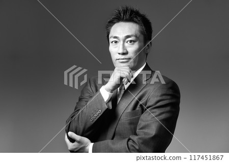 Portrait of a man in a business suit, monochrome image Portrait of a man in a business suit, monochrome image 117451867