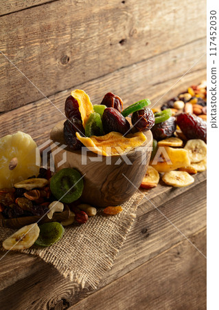 Dried tropical fruits with various nuts and raisins. 117452030