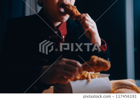 close up focus woman hand hold fried chicken for eat,girl with fast food concept close up focus woman hand hold fried chicken for eat,girl with fast food concept 117456191