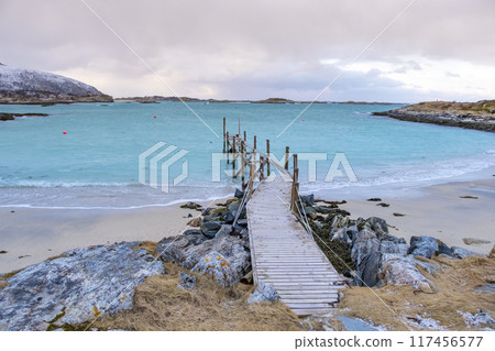 Sommaroy islands and arctic sea near Tromso Norway. Sunset over snowy small islands 117456577