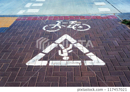 Crossing Marking Signs of Bicycle and Pedestrian Path on Crosswalk. Crossing Marking Signs of Bicycle and Pedestrian Path on Crosswalk. 117457021